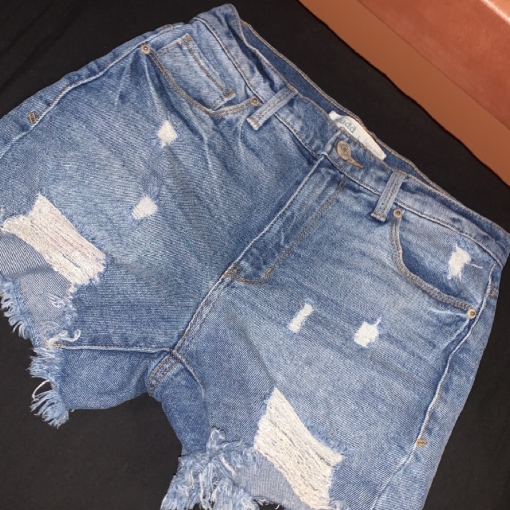 Distressed denim shorts.